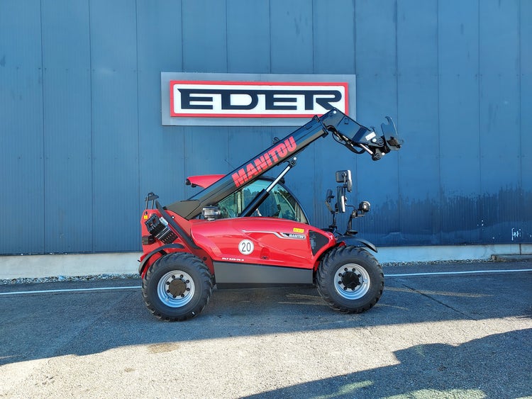 Manitou MLT 625 75K H ST5 S1 Kompakt-Teleskoplader mit angehobenem Arm vor EDER Gebäude